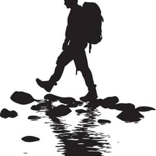 Person walking through shallow water