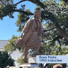 Statues displayed in a Hall of Fame honoring notable inductees.