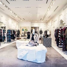 Alice + Olivia clothing displayed in a fashion boutique