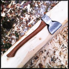 A log showing fresh axe-hewn cuts