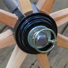 A wagon wheel mounted on an axle.