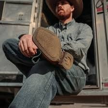 Cowboy boots, a saddle, and other Western riding gear.