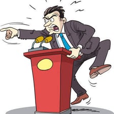 One person forcefully criticizing another during a debate.