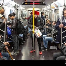 A crowded city commute representing the daily rat race