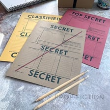 A person examining documents associated with intelligence gathering.