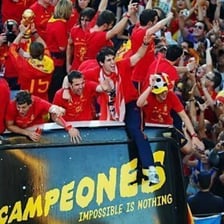 Spanish soccer supporters cheering in the stands.