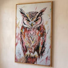 An owl perched on a branch.