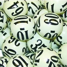 A keno game card beside numbered lottery balls