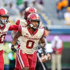 An Oklahoma Sooners athlete wearing team colors