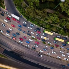A dense line of cars during highway rush hour