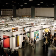 Visitors viewing contemporary artworks at the Art Basel Miami Beach fair.