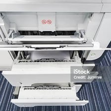 The paper tray of a desktop printer