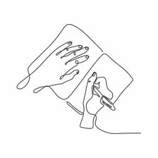 A hand using a pen to draw on paper