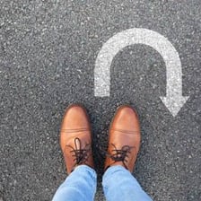 A person or vehicle straying onto the wrong route.