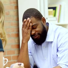 A person expressing disagreement while speaking.