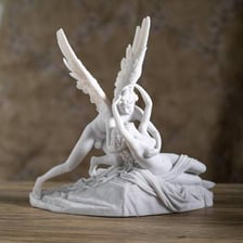 A classical statue depicting Eros, the Greek god of love