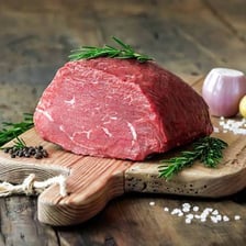 A cooked beef rump roast on a cutting board