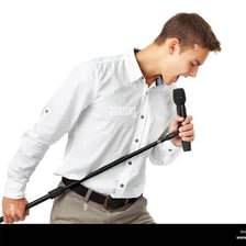 A person singing into a microphone.