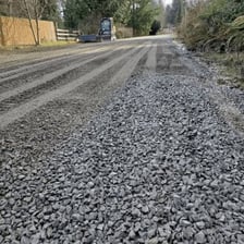 A road covered with loose gravel.
