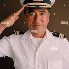 A sailor saluting a ship's captain on a deck
