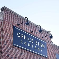 A company sign displaying an incorporated business name.