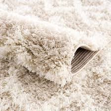 Close-up of a deep-pile shag carpet.