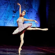 Misty Copeland performing classical ballet on stage.