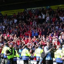 Soccer supporters cheering in a stadium