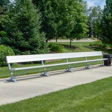 Backup sports players seated on a team bench.