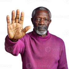A person holding up a hand to signal that it is time to stop.