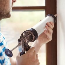 Sealant being applied to close an airtight gap