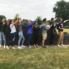 Students following a guide on a college campus tour