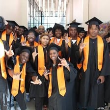 A group of high school seniors celebrating graduation.