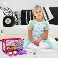 A toy tiara among children’s dress-up accessories.