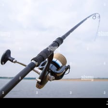 A fishing reel attached to a fishing rod.