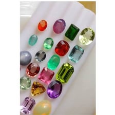 A collection of colorful polished gemstones.