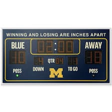 A sports scoreboard showing a close winning score.