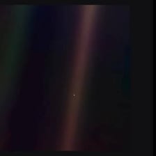 A small dust particle visible in a beam of sunlight
