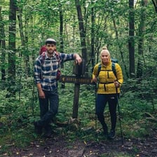 A hiker walking away from a marked trail.