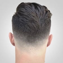 A haircut with hair gradually tapered at the sides