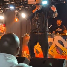 Pioneers of old-school hip-hop performing onstage.