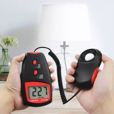 A light meter displaying a lux measurement in an illuminated room.