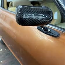 A vehicle side mirror attached beside the car door