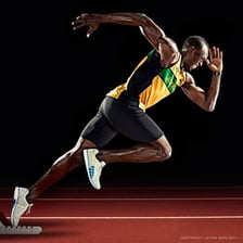 Usain Bolt competing in a track sprint.