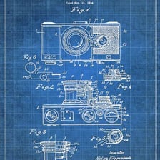 Inventor developing an idea in a sketchbook