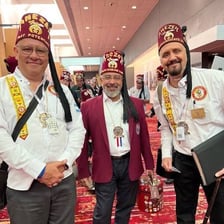A member of the Shriners wearing a red fez.