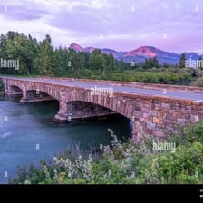 A bridge reaching across a broad river