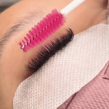 A mascara tube and wand used to thicken eyelashes