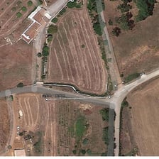 An aerial view of a marked one-acre parcel of land