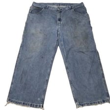 A pair of visibly worn, faded blue jeans.